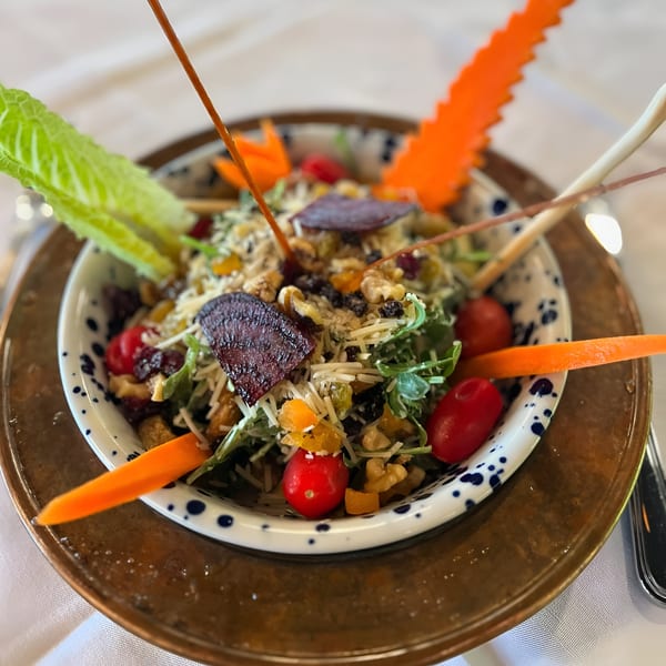 Constantine’s Restaurant's Turkish salad with greens, walnuts, dried fruit, cheese, and cherry tomatoes.