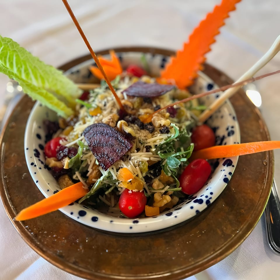 Constantine’s Restaurant's Turkish salad with greens, walnuts, dried fruit, cheese, and cherry tomatoes.